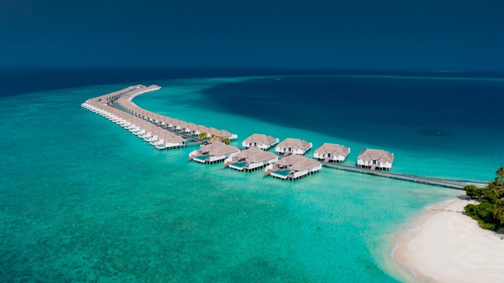 Aerial view of overwater villas in the turquoise waters of Baa Atoll, Maldives. Perfect tropical paradise.